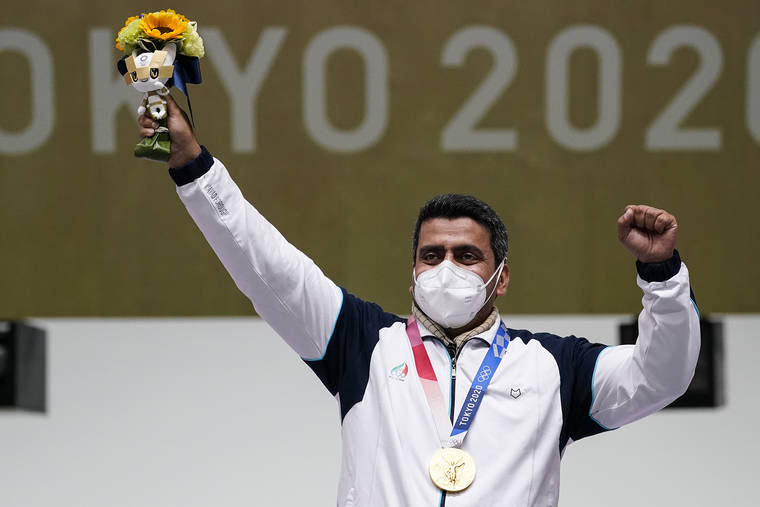 ASSOCIATED PRESS
                                Javad Foroughi, of Iran, celebrates after winning the gold medal in the men’s 10-meter air pistol.