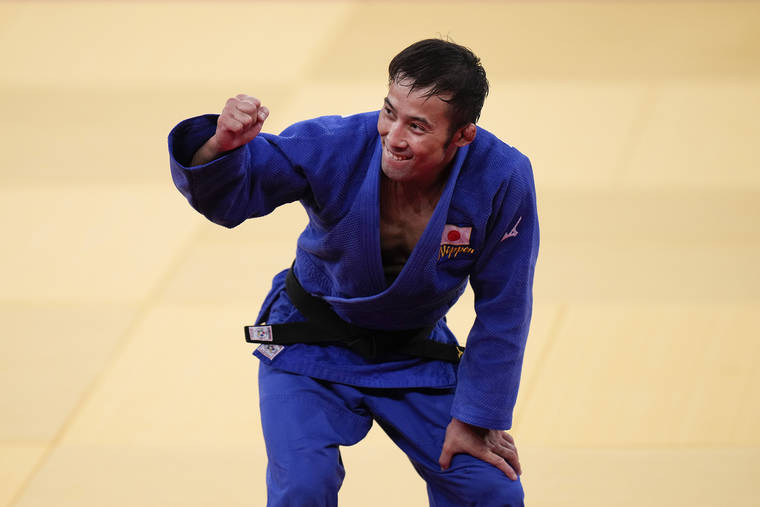 ASSOCIATED PRESS
                                Naohisa Takato, of Japan, celebrates after defeating Yang Yung-wei, of Taiwan.