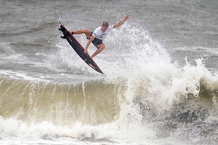 ASSOCIATED PRESS
                                John John Florence, of the United States, goes to the air on a wave during third round of the men’s surfing competition at the 2020 Summer Olympics today at Tsurigasaki beach in Ichinomiya, Japan.