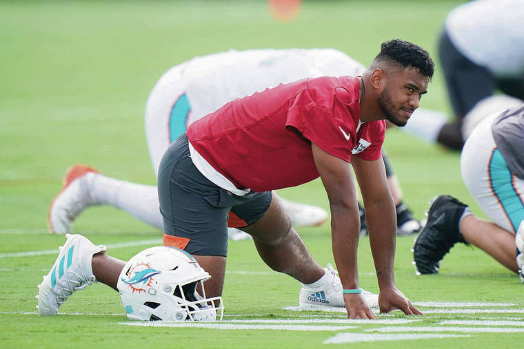 ASSOCIATED PRESS
                                Miami Dolphins quarterback Tua Tagovailoa stretched out during practice on Wednesday in Miami Gardens, Fla.