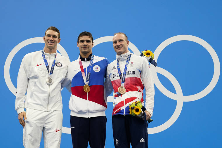 ASSOCIATED PRESS
                                From left, Ryan Murphy, of United States, Evgeny Rylov, of Russian Olympic Committee, and Luke Greenbank, of Britain, pose with their medals after the men’s 200-meter backstroke final.