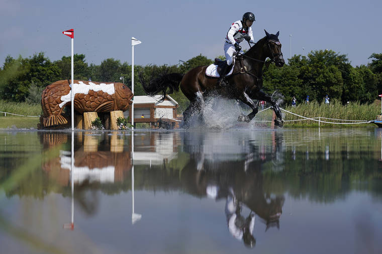 ASSOCIATED PRESS
                                Thailand’s Weerapat Pitakanonda and Carnival March compete during the equestrian eventing cross country competition at the Sea Forest Cross Country Course during the 2020 Summer Olympics on Sunday in Tokyo.