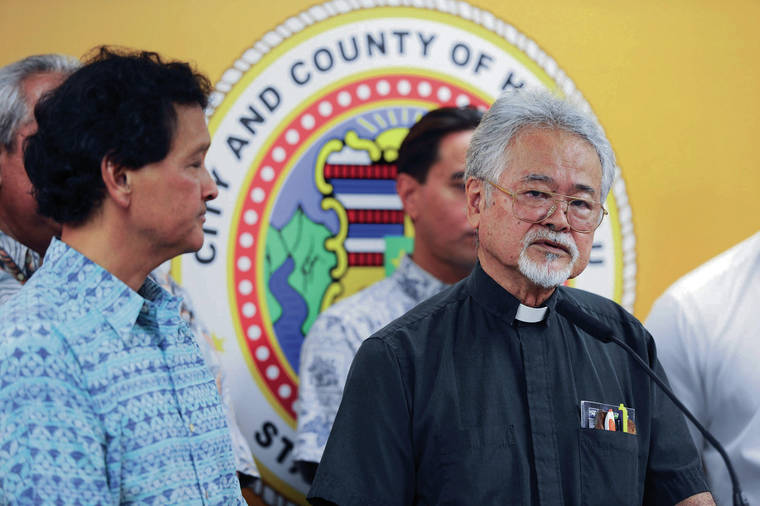 STAR-ADVERTISER / 2017 
                                The Rev. Bob Nakata added comments during a Honolulu City Council news conference about extending the General Excise Tax surcharge tax for rail.
