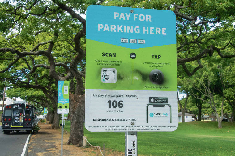 CRAIG T. KOJIMA / CKOJIMA@STARADVERTISER.COM
                                Residents complain new parking signs like the one above, instructing people how to pay for what used to be free parking, are found along Leahi Avenue.