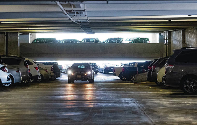 CINDY ELLEN RUSSELL / CRUSSELL@STARADVERTISER.COM
                                Security will be increased in the parking areas at Daniel K. Inouye International Airport to help deter criminal activity, officials say. Above, a vehicle moves in the parking lot of Terminal 1.