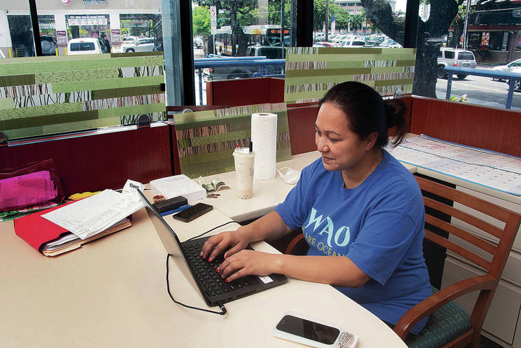 CRAIG T. KOJIMA / CKOJIMA@STARADVERTISER.COM
                                We Are Oceania plans to open a youth center at 555 N. King St., formerly an American Savings Bank branch. Leah Milne worked in the office Friday.