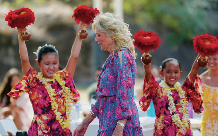 JAMM AQUINO / JAQUINO@STARADVERTISER.COM
                                First lady Jill Biden met with over 75 members of the military and their families before departing Hawaii for Washington, D.C., on Sunday afternoon. Above, Biden walks past hula dancers with Ka Pa Nani o Lilinoe at the gym and recreation area of Makalapa Crater at Joint Base Pearl Harbor-Hickam.