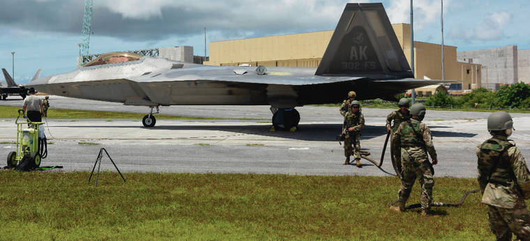 COURTESY U.S. AIR FORCE
                                Air Force personnel perform a field refuel for a F-22 Raptor assigned to the 302nd Fighter Squadron, Joint Base Elmendorf-Richardson, Alaska, during exercise Valiant Shield at Andersen Air Force Base, Guam, on Sept. 24.