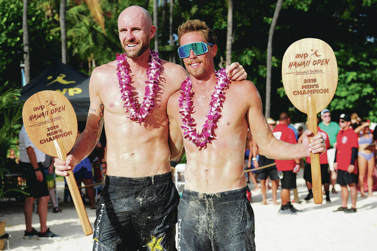 STAR-ADVERTISER / 2019
                                Jake Gibb and Taylor Crabb hold their championship trophies after winning the AVP Hawaii Open beach volleyball men’s finals on Sept. 22, 2019.