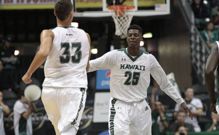 2016 January 6 SPT - Honolulu Star-Advertiser photo by Krystle Marcellus Hawaii Warriors forward Michael Thomas (25) congratulates Hawaii Warriors forward Stefan Jankovic (33), right after he scores in the first half of an NCAA men’s basketball game between the Hawaii Warriors and Cal Poly Mustangs at the Stan Sheriff Center in Manoa on Wednesday, January 6, 2016.