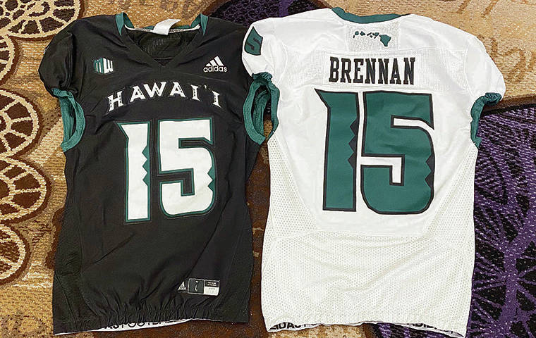 STEPHEN TSAI / STSAI@STARADVERTISER.COM
                                UH displayed a demo of its football jerseys, with the late Colt Brennan’s name and jersey number.