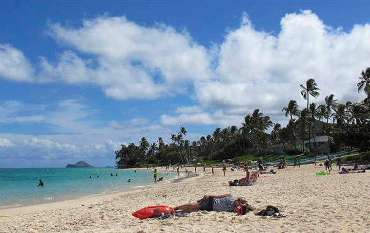 ASSOCIATED PRESS / 2013
                                People at Lanikai Beach, a popular neighborhood for vacation rentals in Kailua, in 2013.