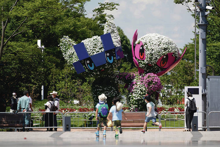 <strong>MASCOTS ON WATCH</strong>: Large topiaries of Miraitowa, official mascot of the Tokyo 2020 Olympics, and Someity, official mascot of the Paralympics, are displayed at the Symbol Promenade Park Flower Plaza in Tokyo.