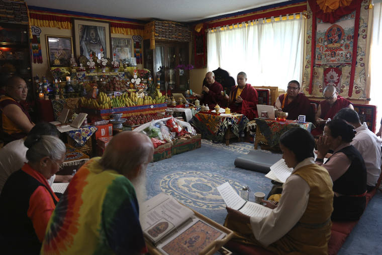ASSOCIATED PRESS
                                Jalue Dorje and his fellow monks pray during a ceremony paying homage to Guru Rinpoche, the Indian Buddhist master who brought Tantric Buddhism to Tibet, at Dorje’s home in Columbia Heights, Minn., on July 19. Over two days the group prayed for victims of natural disasters, war and COVID-19, and for the peace and happiness of beings worldwide.