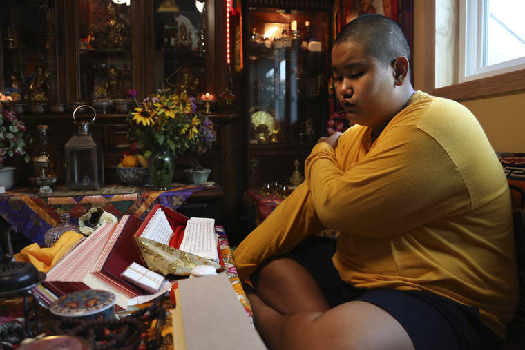 ASSOCIATED PRESS
                                Jalue Dorje, 14, says his morning prayers July 20 in Columbia Heights, Minn. When he was an infant, Jalue, now 14, was identified as the eighth reincarnation of the lama Terchen Taksham Rinpoche. After finishing high school in 2025, Jalue will head to northern India and join the Mindrolling Monastery, more than 7,200 miles from his home.