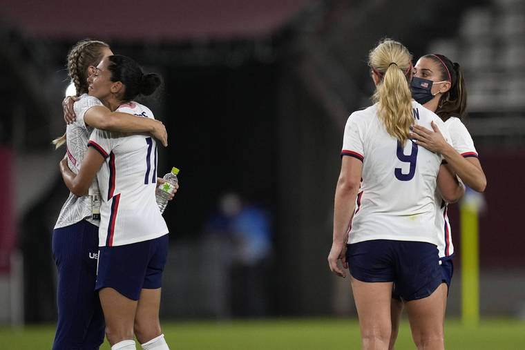 ASSOCIATED PRESS
                                United States players embraced after being defeated 1-0 by Canada during a women’s semifinal soccer match at the 2020 Summer Olympics, Monday, in Kashima, Japan.