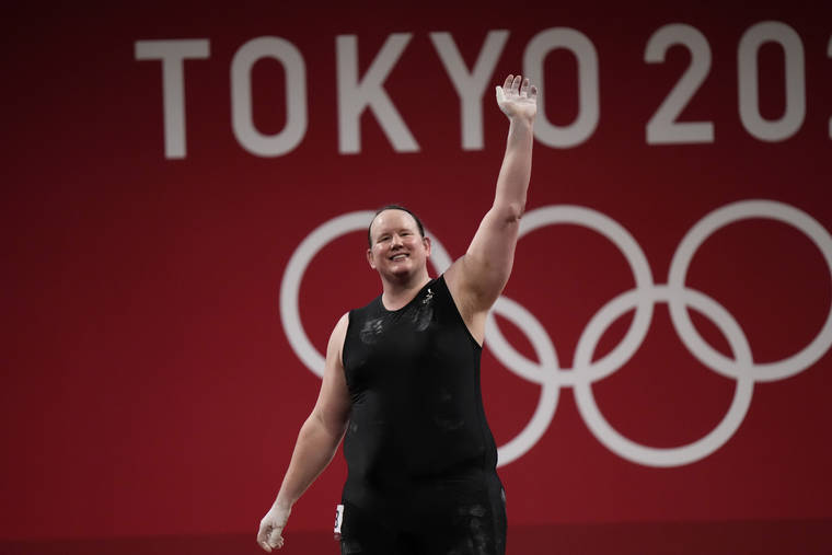 ASSOCIATED PRESS
                                Laurel Hubbard of New Zealand waves after a lift, in the women’s +87kg weightlifting event at the 2020 Summer Olympics, Monday, in Tokyo, Japan.