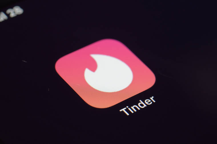 ASSOCIATED PRESS / 2020
                                The icon for the Tinder dating app on a device in New York.
