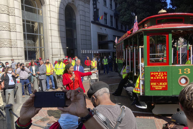 ASSOCIATED PRESS
                                Mayor London Breed welcomes people to return of the cable car service during a ceremony at the Powell Street turnaround plaza in San Francisco on Monday.