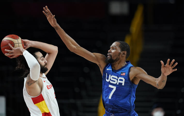 ASSOCIATED PRESS
                                United States’ Kevin Durant, right, tries to block Spain’s Ricky Rubio, left, during a men’s basketball quarterfinal game at the 2020 Summer Olympics, Tuesday, in Saitama, Japan.