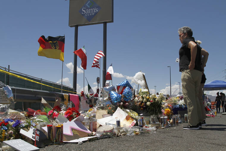 ASSOCIATED PRESS / 2019
                                Mourners visit the makeshift memorial near the Walmart in El Paso, Texas, where 22 people were killed in a mass shooting. Officials in the border city are unveiling a garden meant to bring healing two years after a gunman targeting Latinos opened fire, ultimately killing 23 people in an attack that stunned the U.S. and Mexico.