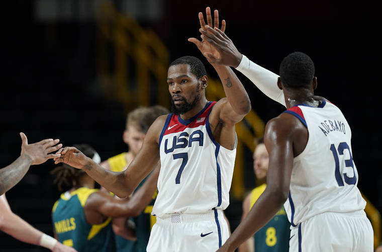 ASSOCIATED PRESS
                                United States’s Kevin Durant celebrates with teammates after scoring during men’s basketball semifinal game against Australia at the 2020 Summer Olympics, Thursday, in Saitama, Japan.