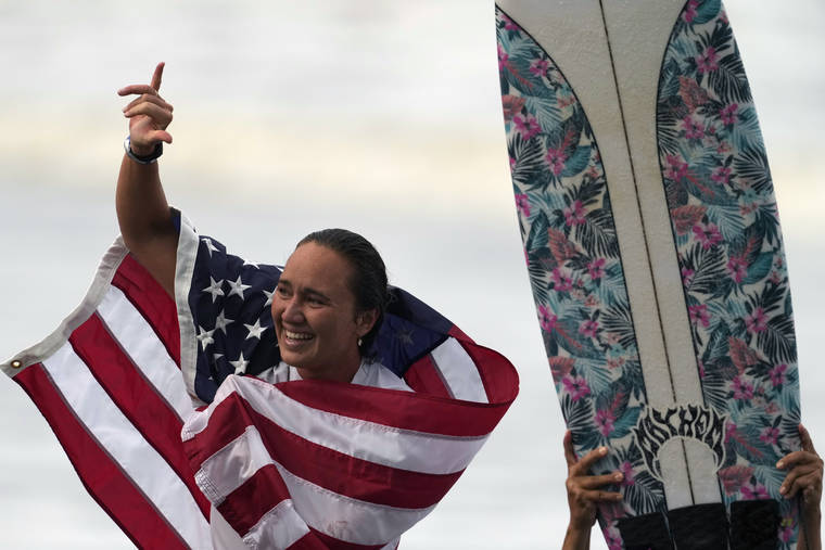 ASSOCIATED PRESS
                                Carissa Moore, of the United States, celebrated winning the gold medal, July 27, in the women’s surfing competition at the 2020 Summer Olympics at Tsurigasaki beach in Ichinomiya, Japan. The first Olympic gold medalist for surfing, Moore, is the only Native Hawaiian surfer at the Games.