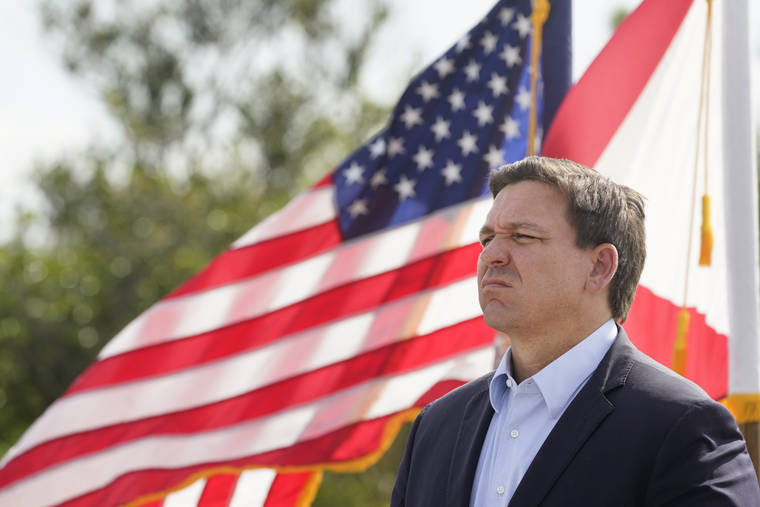 ASSOCIATED PRESS
                                Florida Gov. Ron DeSantis listens during a news conference, Tuesday, near the Shark Valley Visitor Center in Miami.
