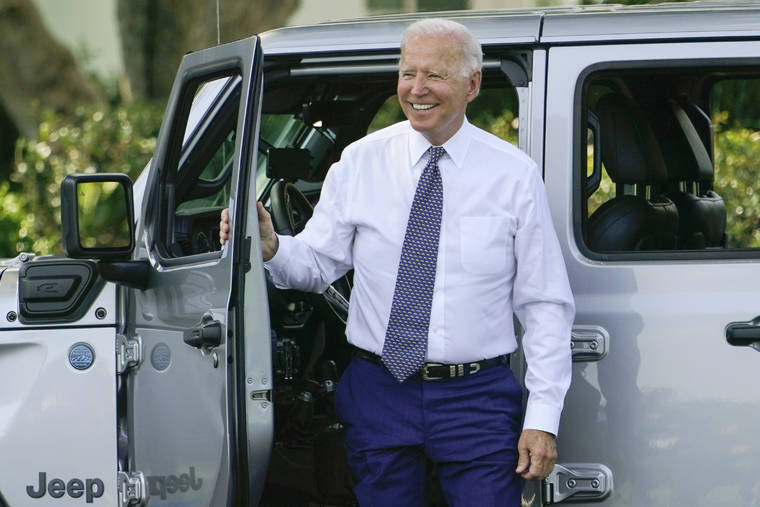 ASSOCIATED PRESS
                                President Joe Biden smiles after driving a Jeep Wrangler 4xe Rubicon on the South Lawn of the White House in Washington, Thursday.