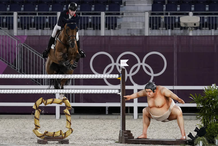 ASSOCIATED PRESS
                                Britain’s Harry Charles, riding Romeo 88, competed during the equestrian jumping individual qualifying at Equestrian Park in Tokyo at the 2020 Summer Olympics, Tuesday, in Tokyo, Japan.