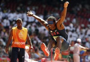 ASSOCIATED PRESS / 2008
                                The United States’ Lex Gillette, right, jumps as his escort, left, looks on during the men’s triple jump F11 at the Beijing 2008 Paralympic Games.