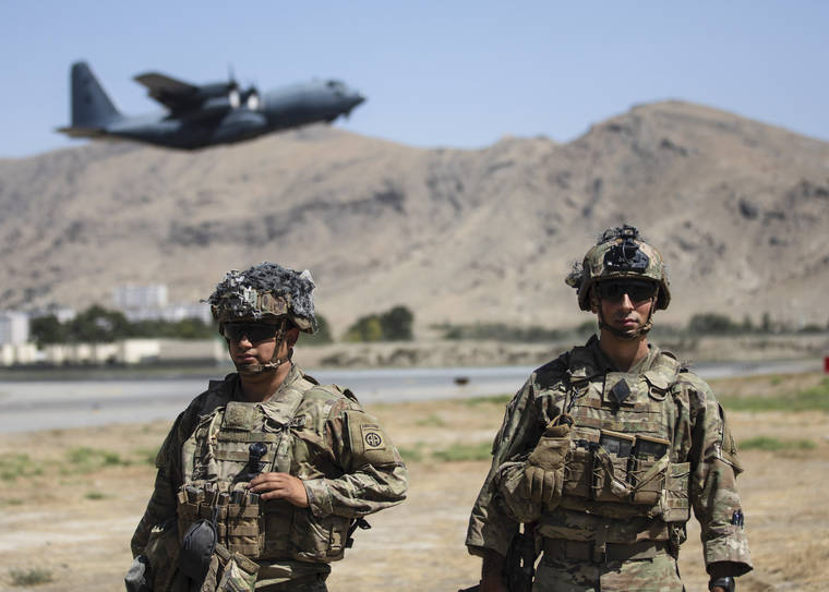 DEPARTMENT OF DEFENSE VIA ASSOCIATED PRESS
                                Two paratroopers assigned to the 1st Brigade Combat Team, 82nd Airborne Division conducted security while a C-130 Hercules took off during an evacuation operation in Kabul, Afghanistan, Wednesday.