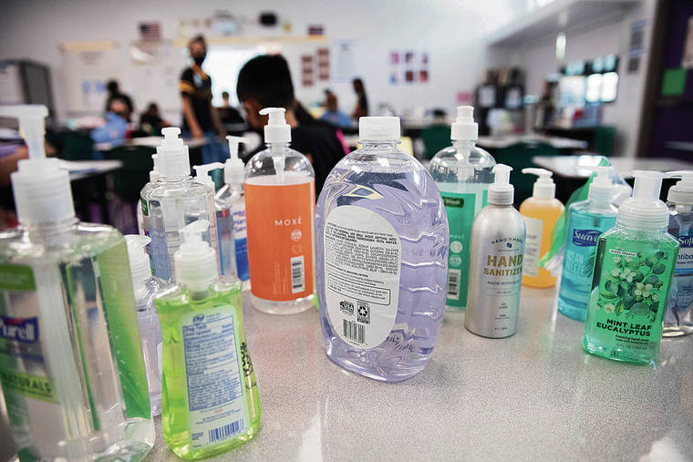 CINDY ELLEN RUSSELL / CRUSSELL@STARADVERTISER.COM
                                Pictured above are bottles of hand sanitizer and soap brought in by students.