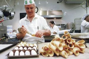 ASSOCIATED PRESS / 2008
                                Chef Franco Amati fills deep-fried cannoli shells at Ferrara Bakery in New York. Ferrara and other New York food establishments have been banned from cooking with trans fats since 2008.