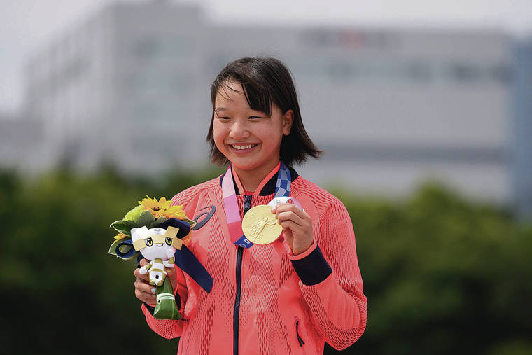 ASSOCIATED PRESS / JULY 26
                                Teen Momiji Nishiya was the top competitor in the women’s street skateboarding finals at the Olympics in Tokyo. She later wore the gold medal — and her trademark big smile, above.