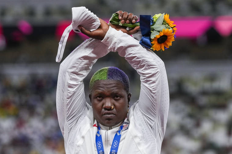 ASSOCIATED PRESS
                                Raven Saunders, of the United States, poses with her silver medal on women’s shot put at the 2020 Summer Olympics, Sunday, in Tokyo, Japan.