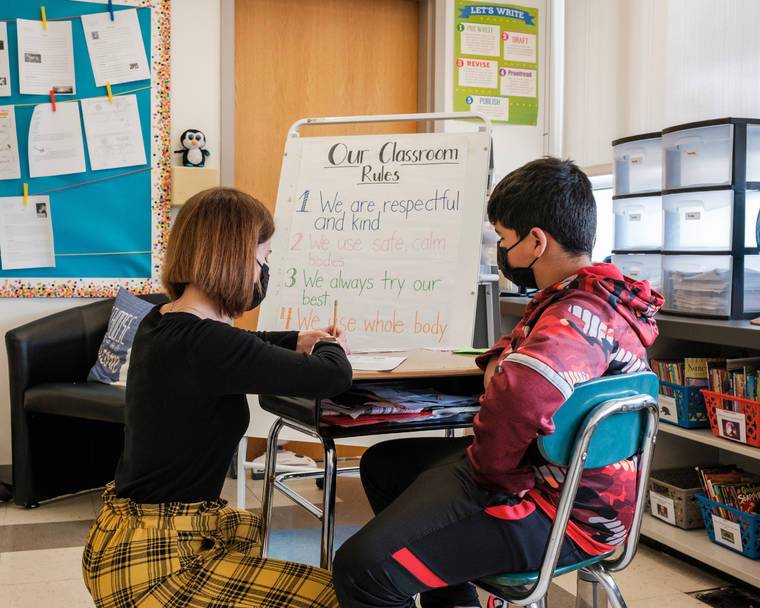 NEW YORK TIMES / APRIL 30
                                A teacher works one-on-one with a student at Witchcraft Heights Elementary School in Salem, Mass.