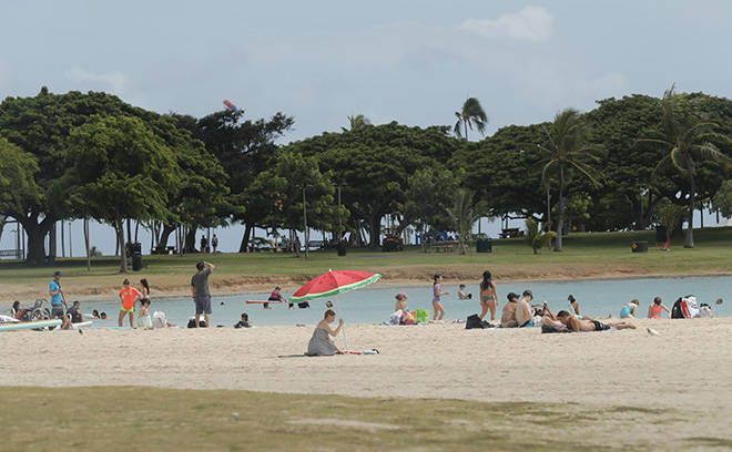 JAMM AQUINO / JULY 21
                                Beachgoers enjoy Ala Moana Regional Park on a recent day in July. Hawaii has been experiencing a large spike in coronavirus cases over the past weeks. Active infections spiked past 3,000 over the weekend, an increase from below 600 just three weeks ago.