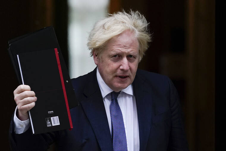 ASSOCIATED PRESS / AUG. 18
                                British Prime Minister Boris Johnson, seen here leaving 10 Downing Street last month, is expected to discuss the decision to scrap the vaccine passport idea Tuesday.