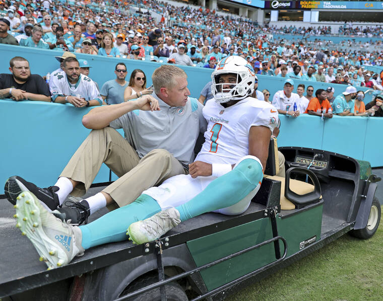 DAVID SANTIAGO/MIAMI HERALD VIA ASSOCIATED PRESS
                                Miami Dolphins quarterback Tua Tagovailoa was carted off the field after getting injured in a play during the first quarter of a game against the Buffalo Bills at Hard Rock Stadium, Sunday, in Miami Gardens, Fla. Tagovailoa has fractured ribs and will not play Sunday when the Miami Dolphins visit the Las Vegas Raiders.