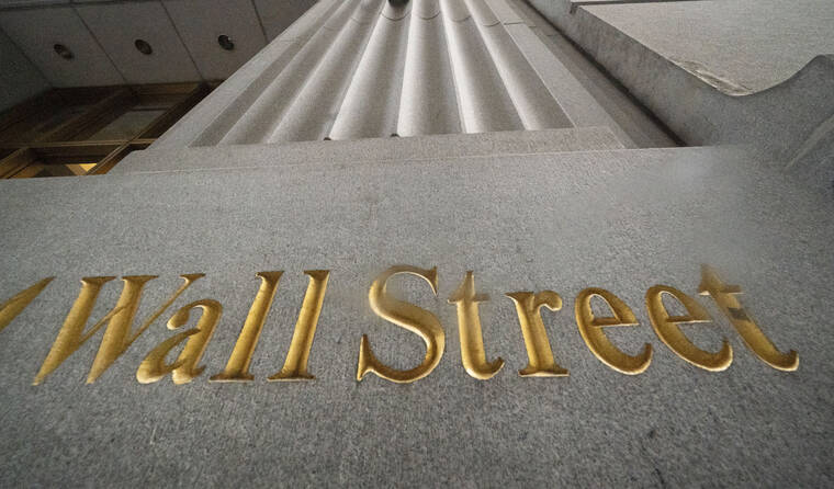 ASSOCIATED PRESS / 2020
                                A sign for Wall Street is carved in the side of a building, in New York. Stocks are opening slightly higher on Wall Street today, a day after closing out September with their first monthly loss since January.