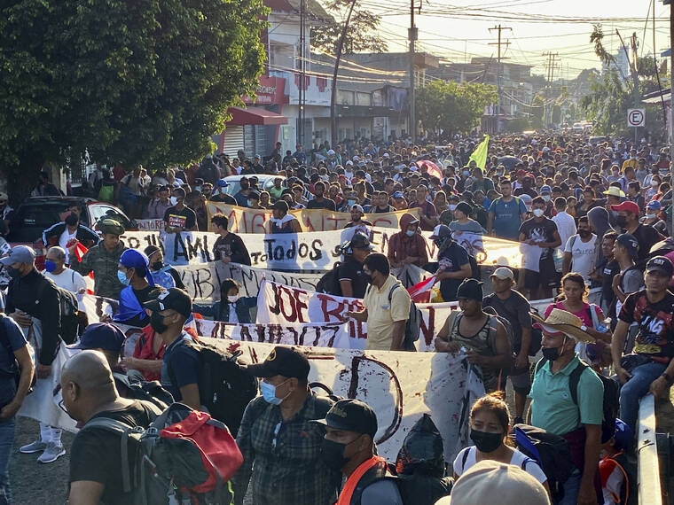 ASSOCIATED PRESS
                                A caravan of migrants, most from central America, head north as they depart from Tapachula, Mexico. Immigration activists say they will lead migrants out of the southern Mexico city of Tapachula Saturday at the start of a march they hope will bring them to Mexico City to press their case for better treatment.