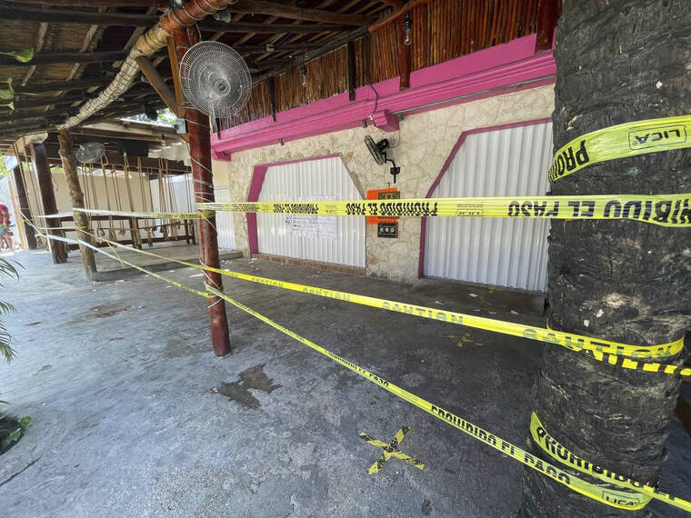 ASSOCIATED PRESS / OCT. 22
                                Police security tape covers the exterior of a restaurant the day after a fatal shooting in Tulum, Mexico. Two foreigners were killed and three wounded in a shooting in the Mexican Caribbean resort town of Tulum.