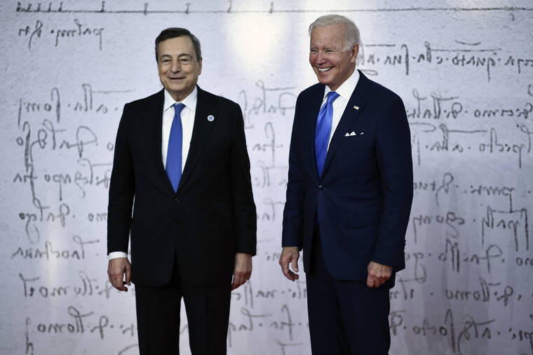ASSOCIATED PRESS
                                U.S. President Joe Biden is welcomed by Italy’s Prime Minister Mario Draghi as he arrives at the La Nuvola conference center for the G20 summit in Rome, today. The two-day Group of 20 summit is the first in-person gathering of leaders of the world’s biggest economies since the COVID-19 pandemic started.