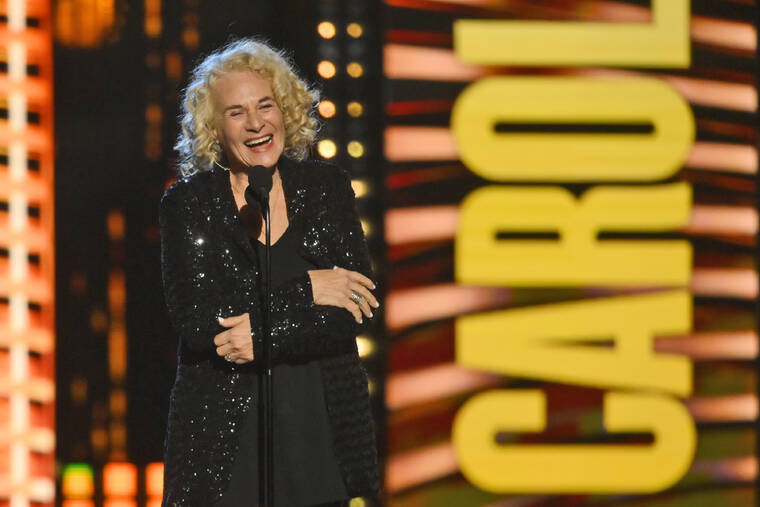 ASSOCIATED PRESS
                                Carole King speaks after being inducted in the performer category during the Rock and Roll Hall of Fame Induction ceremony today in Cleveland.