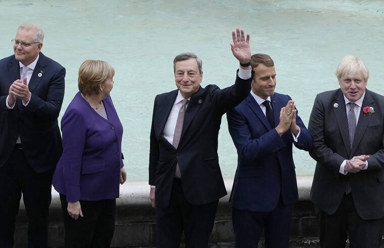 ASSOCIATED PRESS
                                From left, Australia’s Prime Minister Scott Morrison, German Chancellor Angela Merkel, Italy’s Prime Minister Mario Draghi, French President Emmanuel Macron and British Prime Minister Boris Johnson pose in front of the Trevi Fountain during an event for the G20 summit in Rome, today. The two-day Group of 20 summit concludes today, the first in-person gathering of leaders of the world’s biggest economies since the COVID-19 pandemic started.