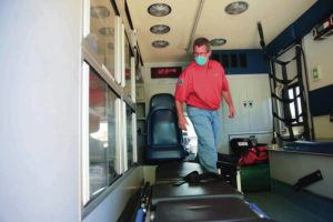JAMM AQUINO / JAQUINO@STARADVERTISER.COM
                                The new CORE program will assist with homeless 911 calls using refurbished city ambulances. Dr. Jim Ireland, director of Honolulu’s Emergency Services department, stood Thursday in one of the new CORE ambulances.