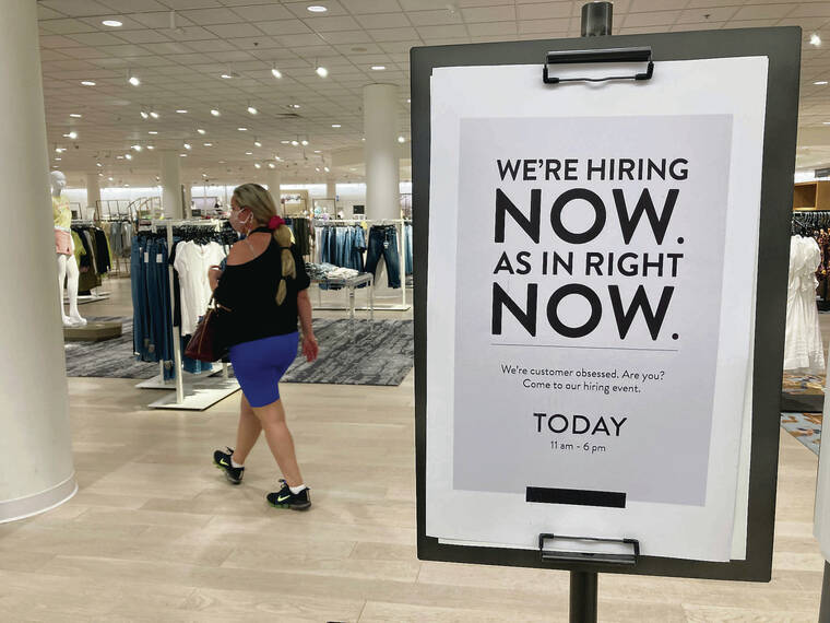 ASSOCIATED PRESS
                                In the U.S. there were 10.4 million job openings at the end of August, the highest on record since at least December 2000, evidence that the pandemic still has a grip on the economy, with many companies struggling to fill the open jobs. A customer walks behind a sign at a Nordstrom store seeking employees in Coral Gables, Fla.