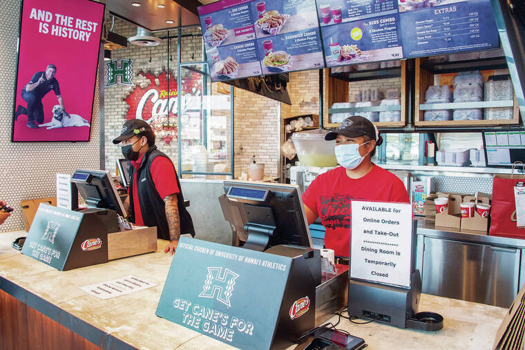 CRAIG T. KOJIMA / CKOJIMA@STARADVERTISER.COM
                                Raising Cane’s is in an expansion mode and has to hire at least 100 more workers in December.