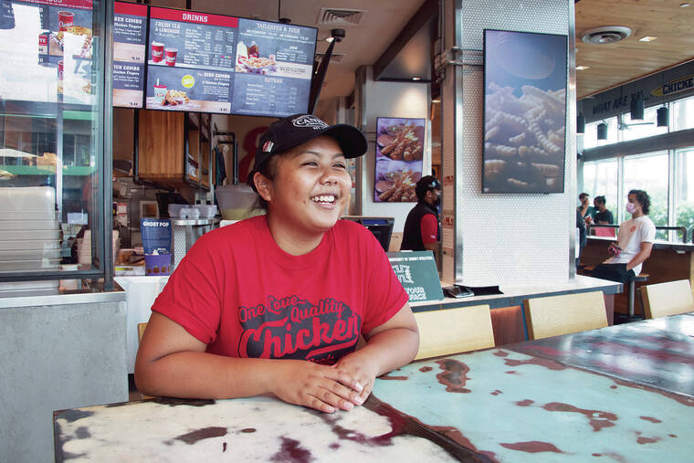 CRAIG T. KOJIMA / CKOJIMA@STARADVERTISER.COM
                                Katelyn Prak decided to work for Raising Cane’s as a cashier after considering flexibility, location and work environment.